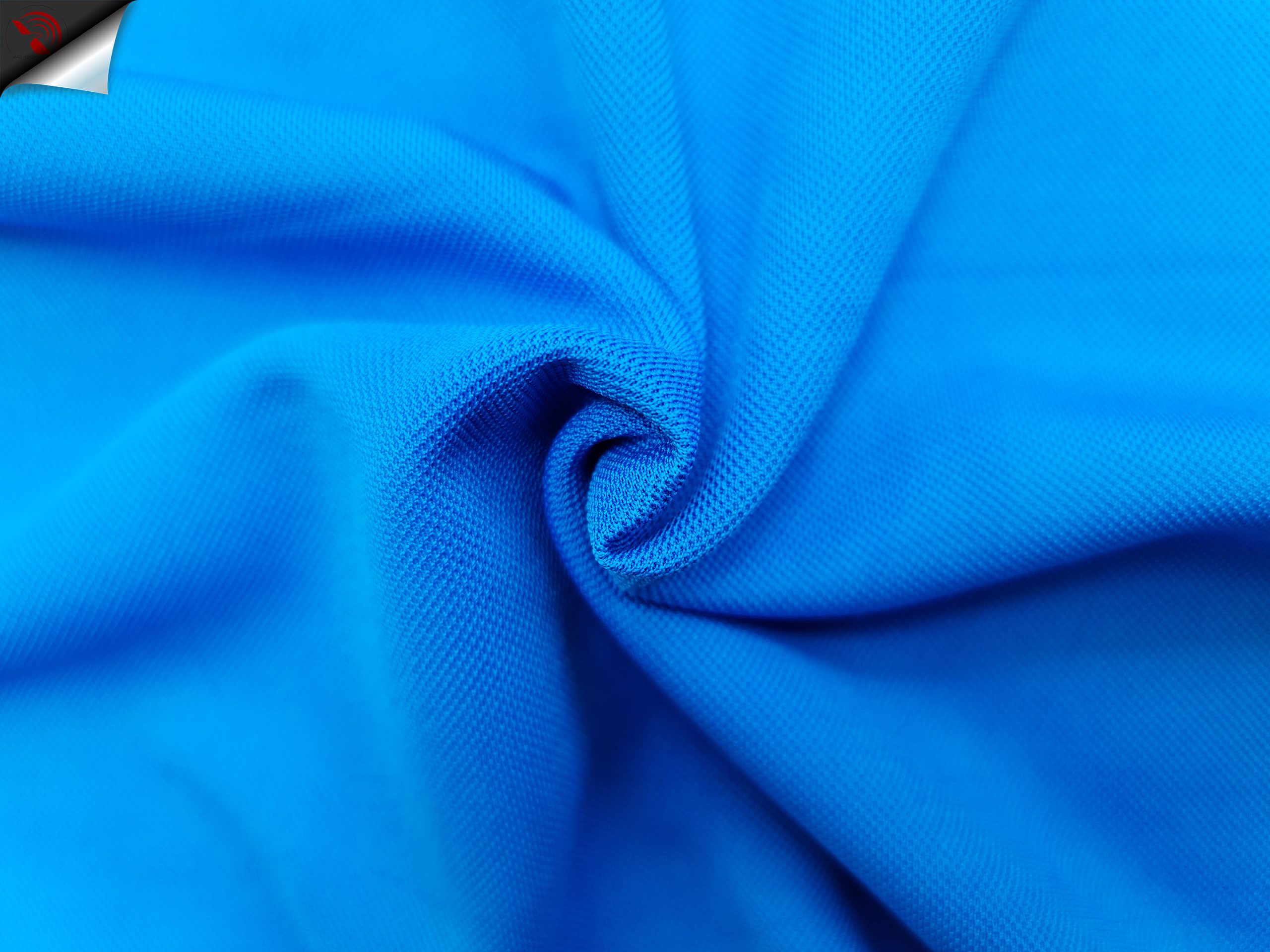 Hình chụp cận cảnh chất vải áo polo bo trơn cá sấu mè unisex xanh ya