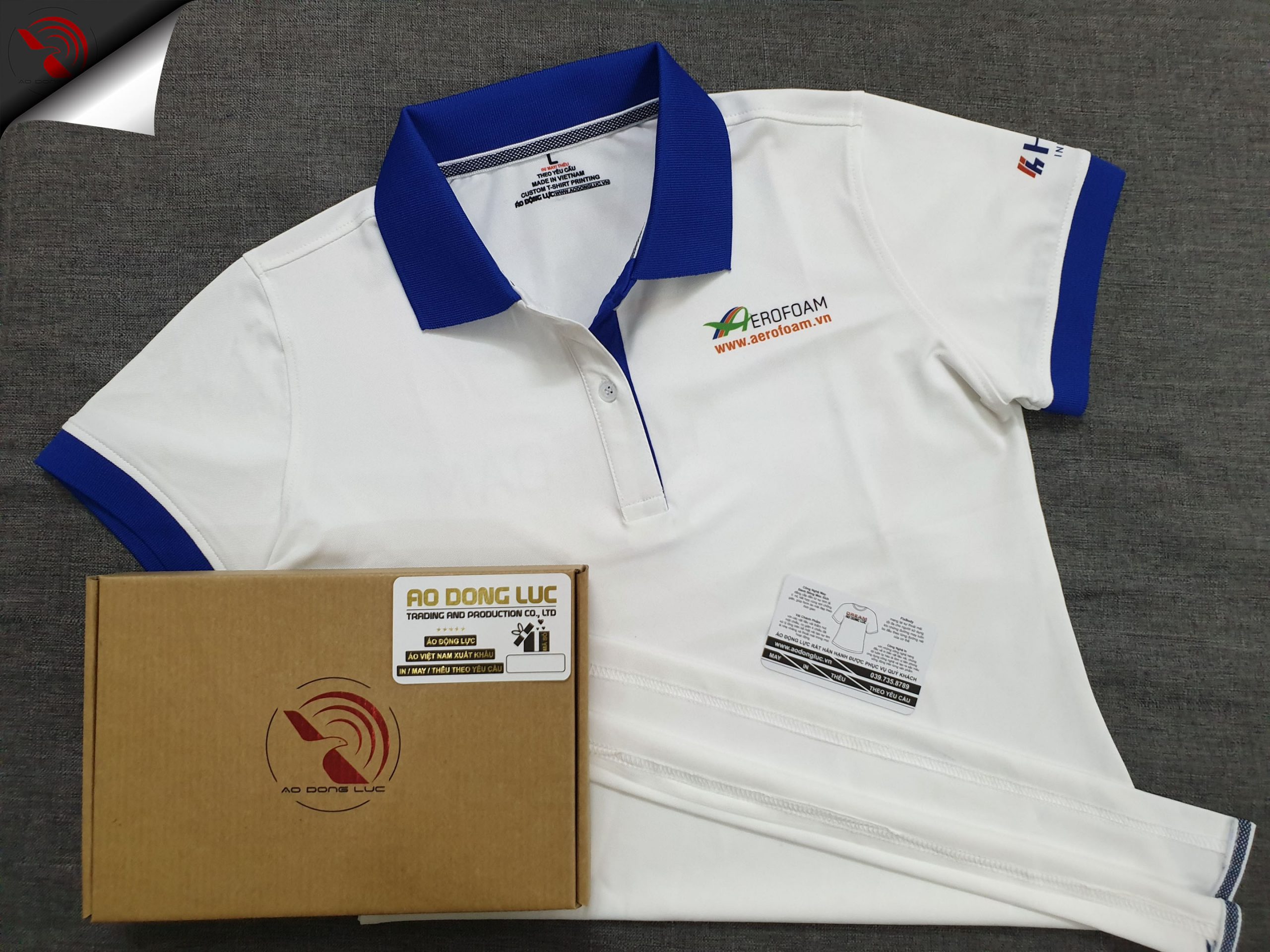 Đồng phục áo thun polo màu trắng phối xanh bích in chuyển nhiệt logo