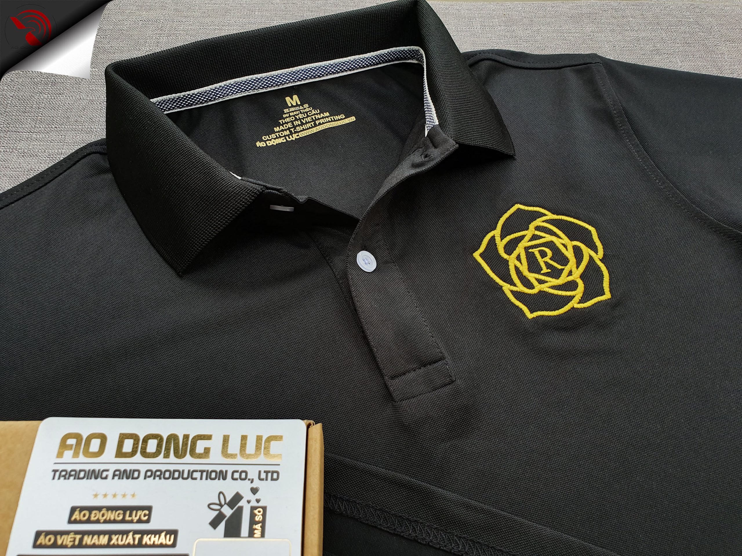 Đồng phục áo thun polo bo trơn màu đen thêu logo